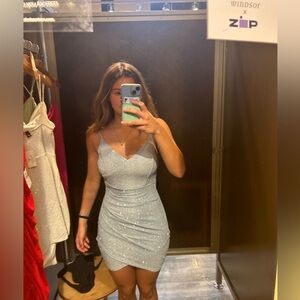 Beautiful flatter light blue dress with silver sparkles